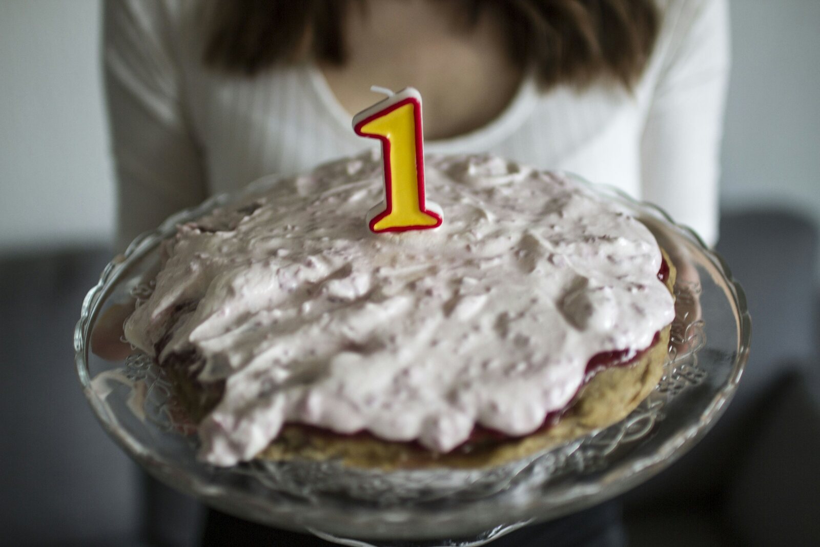 First birthday cake with a number one candle