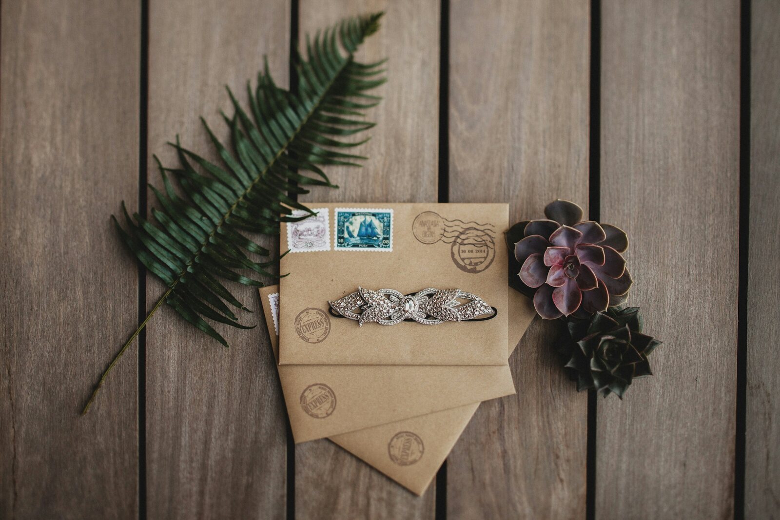 Wedding cards in kraft envelopes on a wooden table, ready to be kept as a keepsake